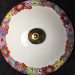 The missing areas are easily camouflaged by the floral motif making the repair an appropriate and more economical option.