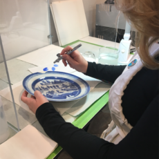 Carrie working on a piece of Chinese Export. Decorative China Repair & Restoration Service at Sundog Restoration Studio