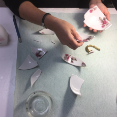 Reassembling a Haviland teacup.