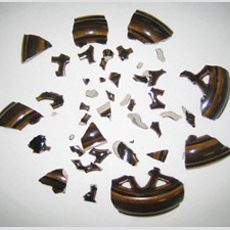 We reassembled, filled, created missing areas, painted and glazed this pottery lid that was broken in approximately 45 pieces. Pottery Repair & Restoration Service at Sundog Restoration Studio